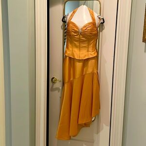 Sophisticated high and low, open shoulder gala dress.